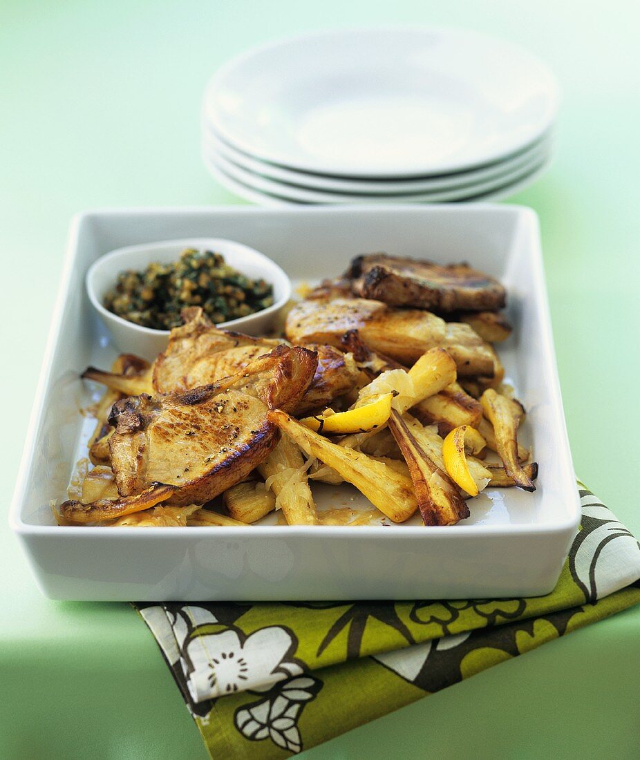 Pork chops with roasted parsnips and lemon