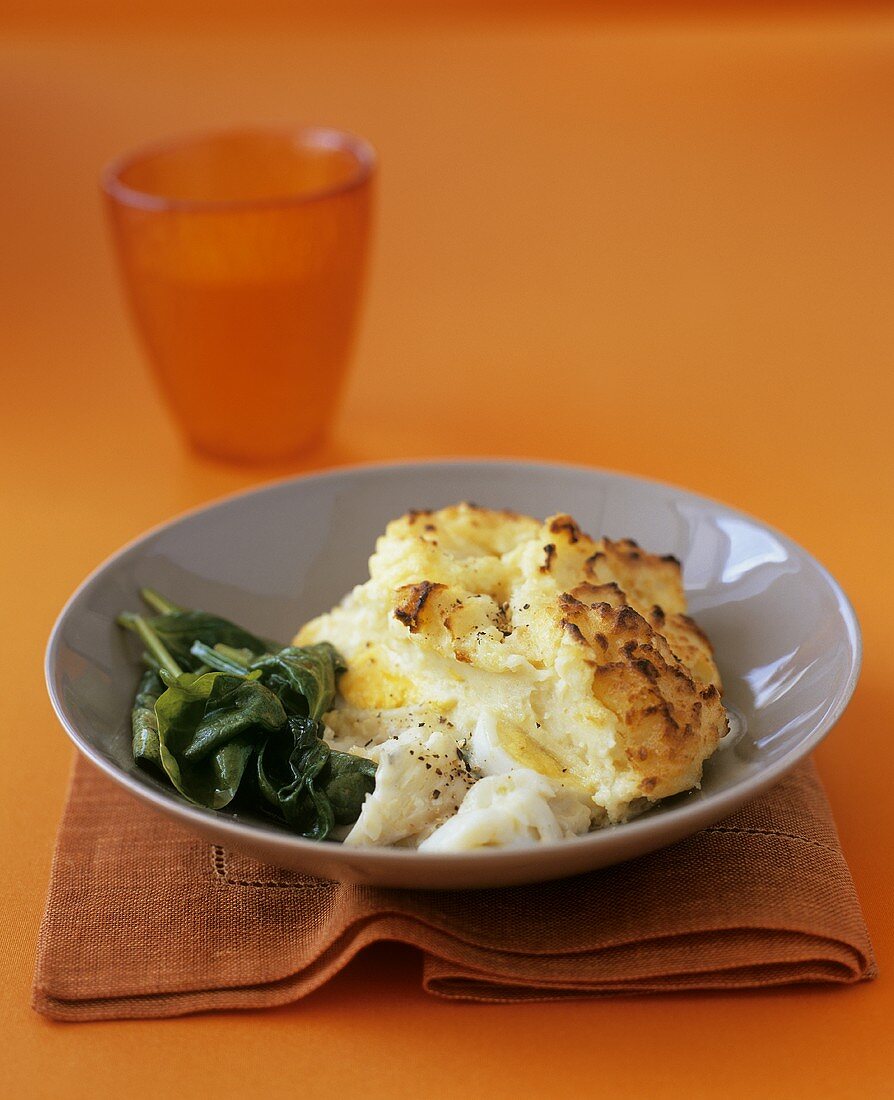 Smoked haddock pie with mashed potato and parsnip, spinach