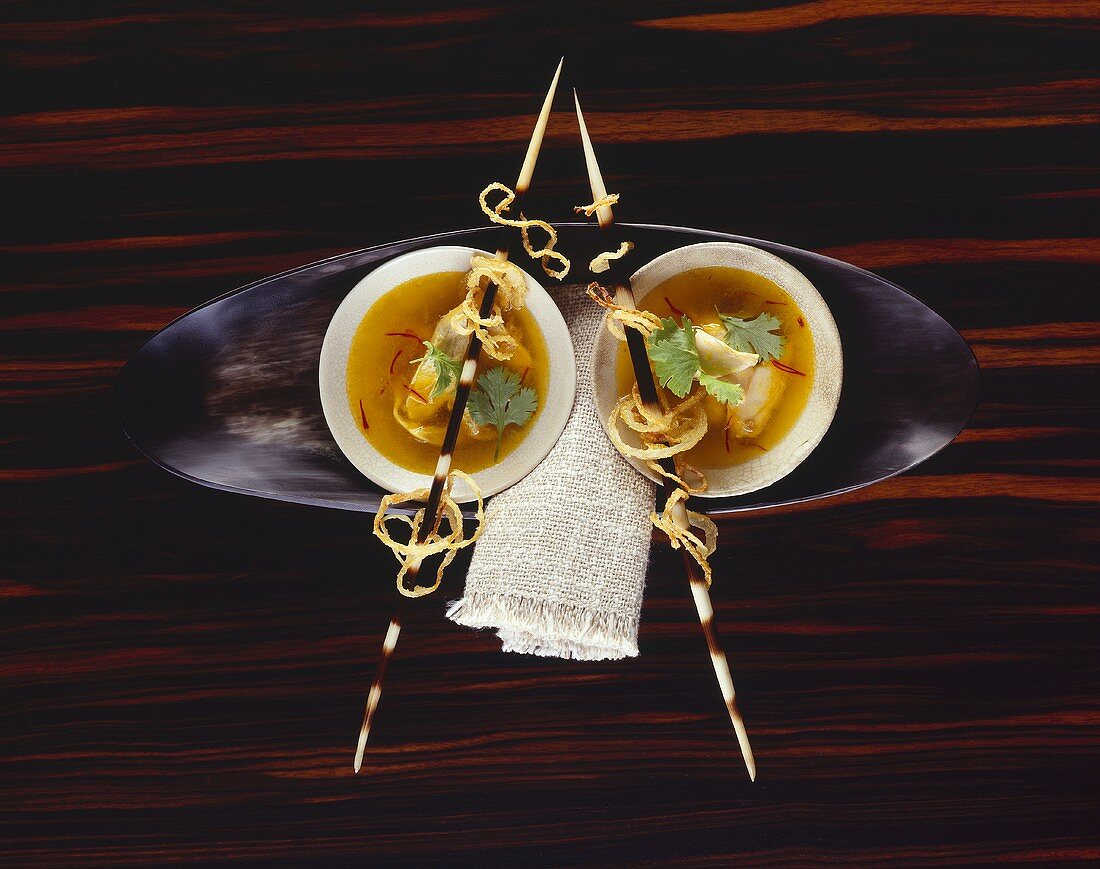 Curry soup with mushroom ravioli