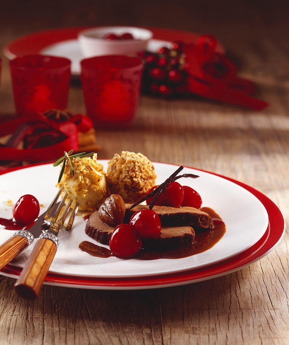 Leg of venison with cherry sauce and chestnut dumplings