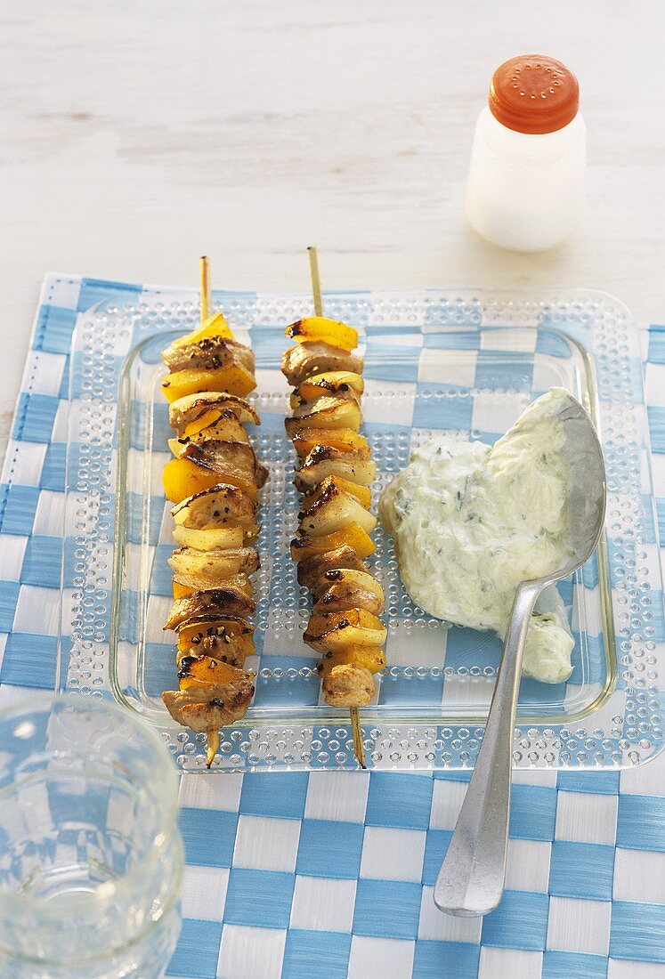 Grilled pork and pepper kebabs with tzatziki