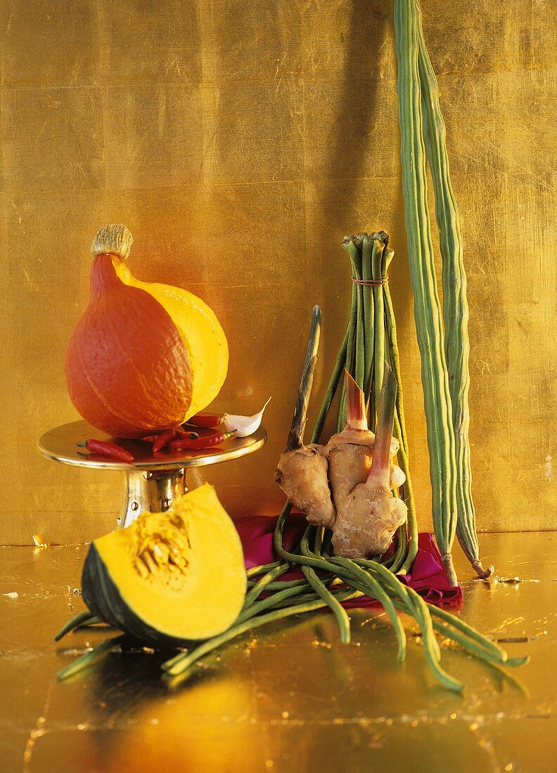 Exotic vegetable still life against gold background