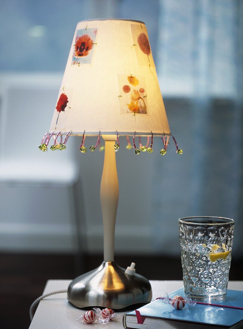 Table lamp decorated with beads and flowers