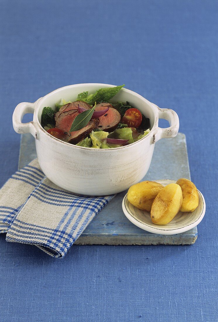 Savoy cabbage stew with pork fillet, caramelised potatoes