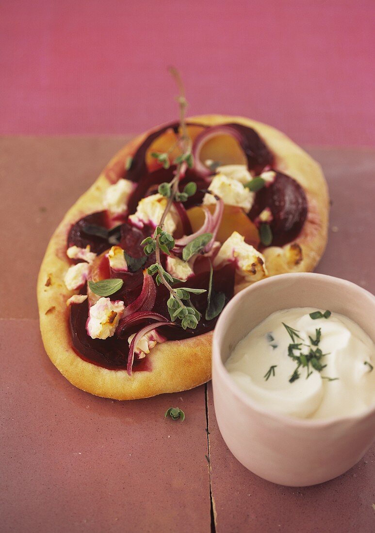 Beetroot and potato pizza with sheep's cheese and herb quark