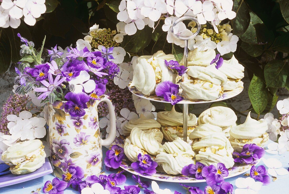 Pistachio meringues on tiered stand, floral decoration