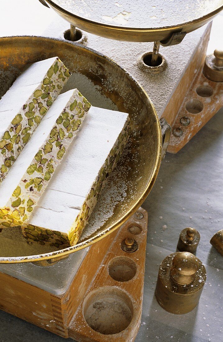 Nougat with pistachios on scales