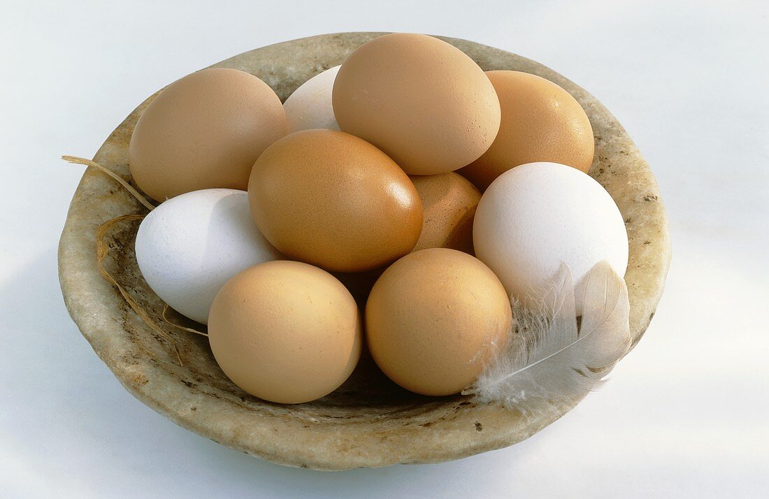 Dish of white and brown eggs