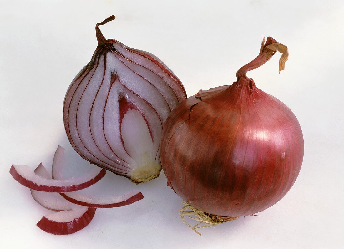 Whole red onion and half a red onion