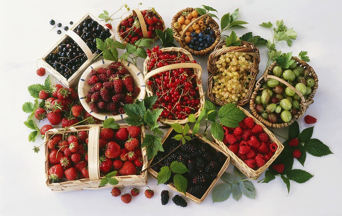 Various fresh berries in baskets