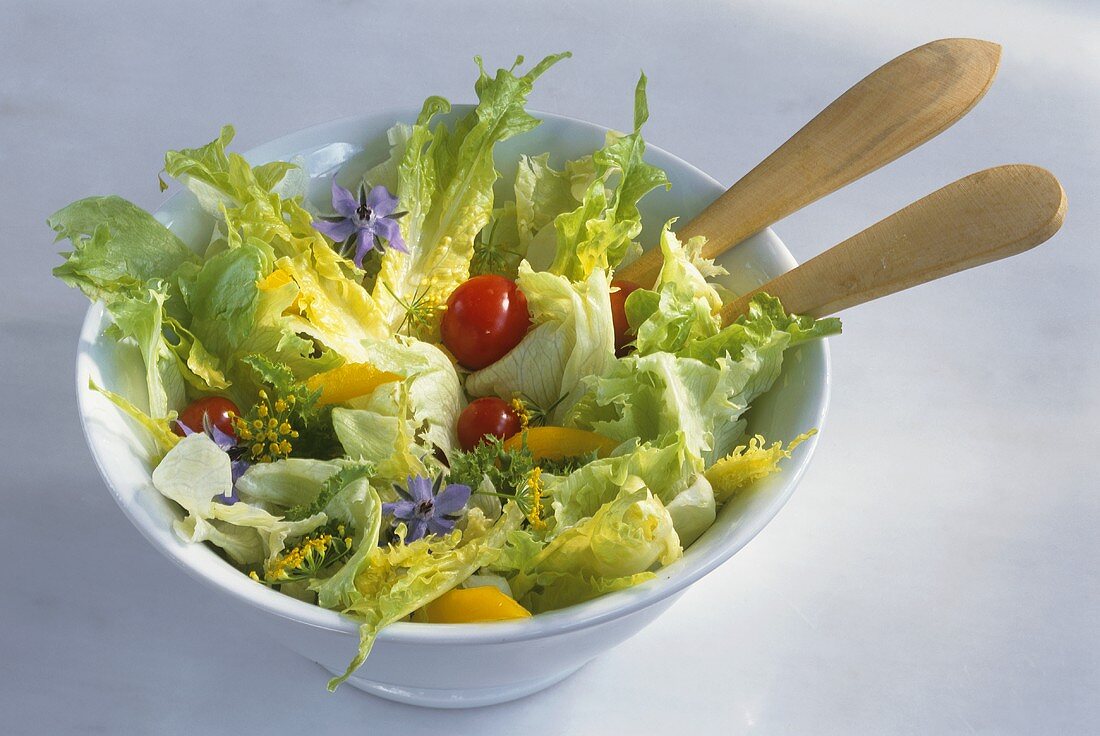 Romaine lettuce with vegetables and borage flowers