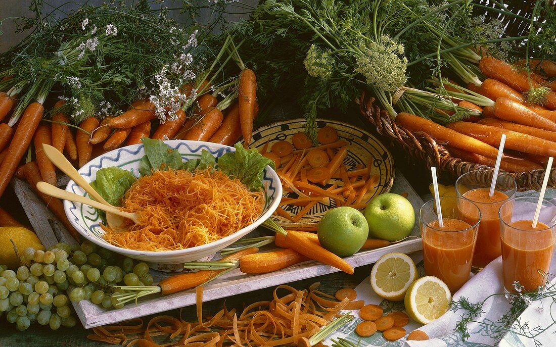 Still life: carrots, carrot juice, carrot salad