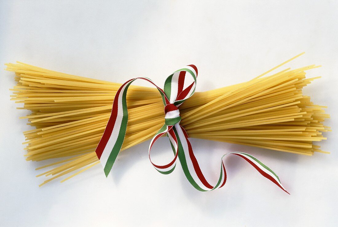 Bundle of spaghetti tied with striped ribbon