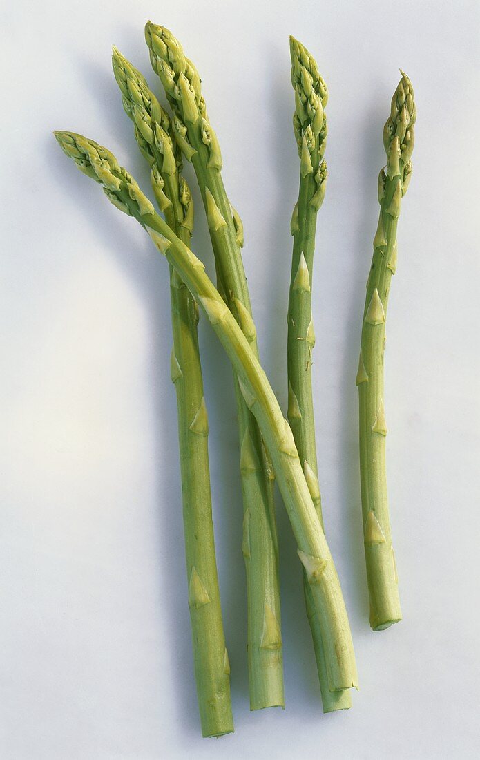 Five spears of green asparagus