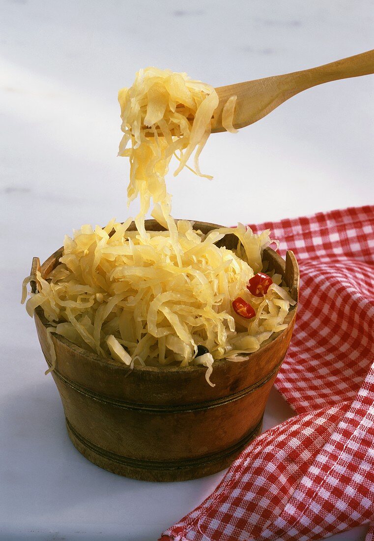 Tub of sauerkraut with wooden fork