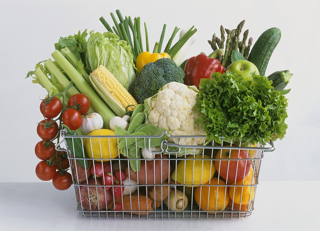 Shopping basket full of different vegetables