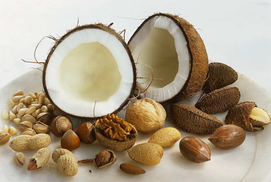 Assorted nuts, shelled and unshelled, on a plate