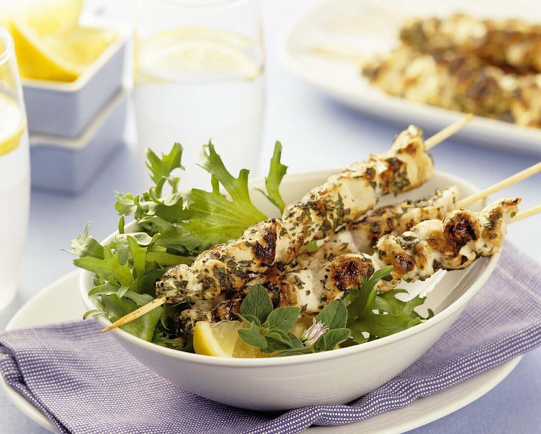 Grilled chicken skewers with herbs