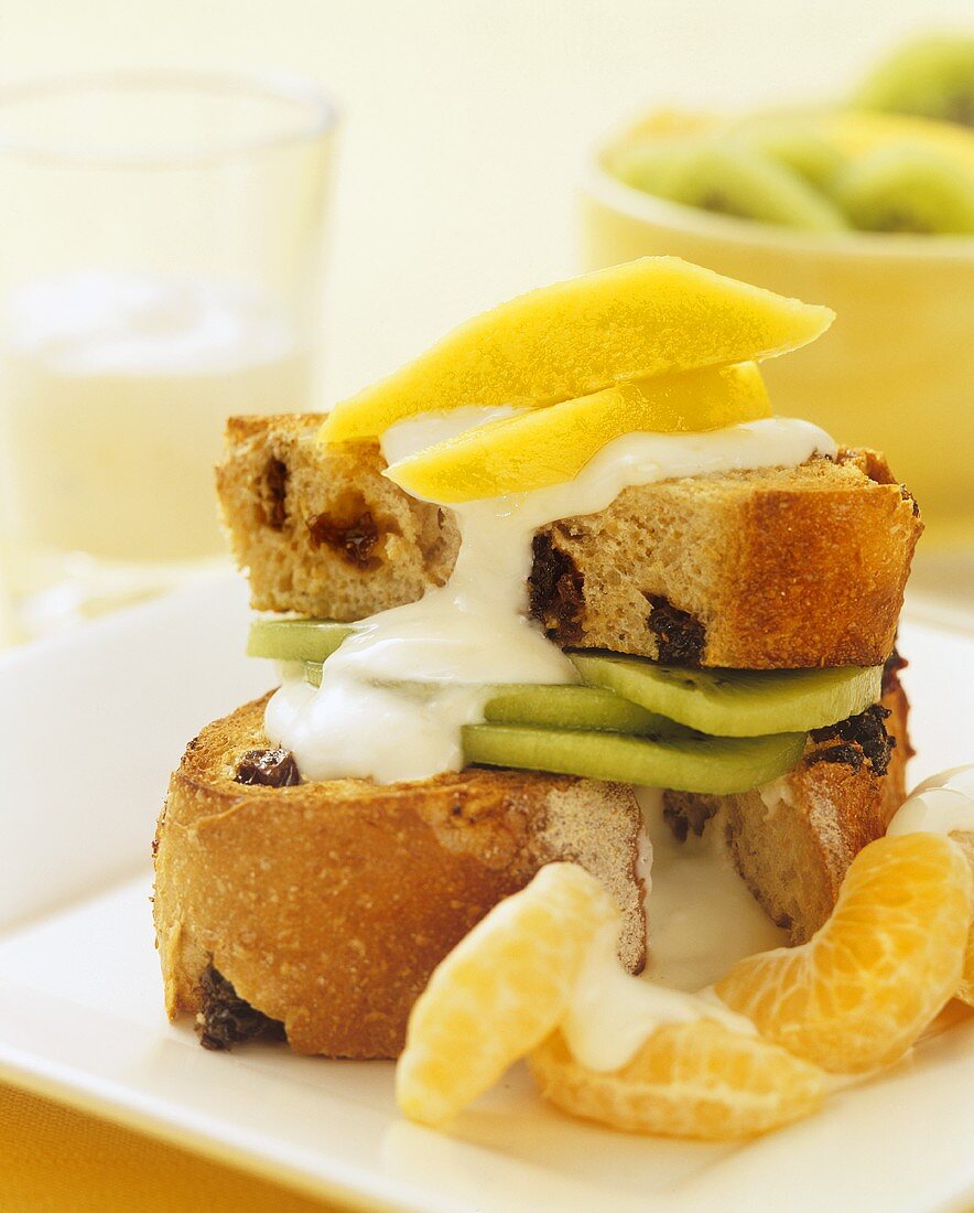 Toasted fruit bread with fruit and yoghurt for breakfast