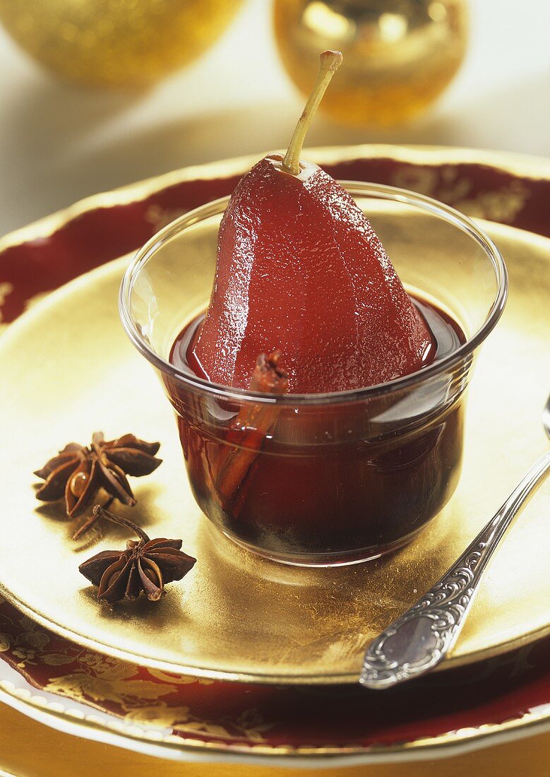 Pear in mulled wine in a glass