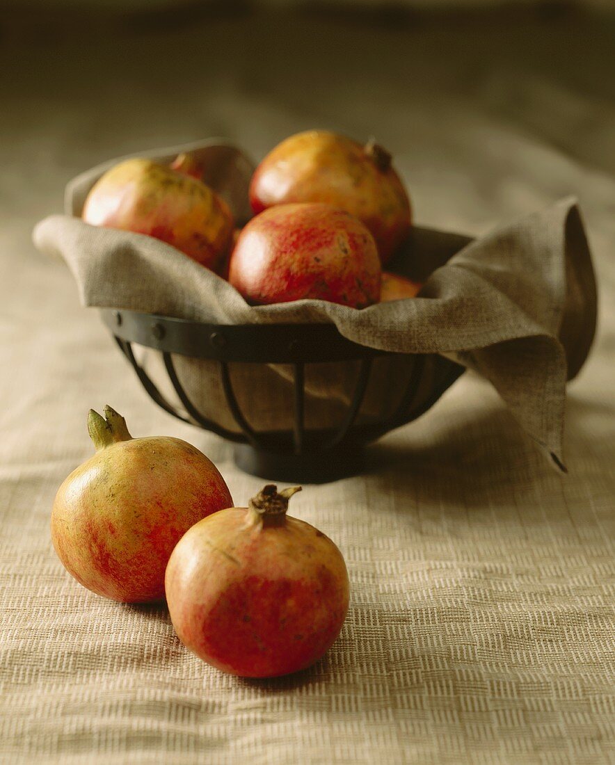 Pomegranates in and beside a dish