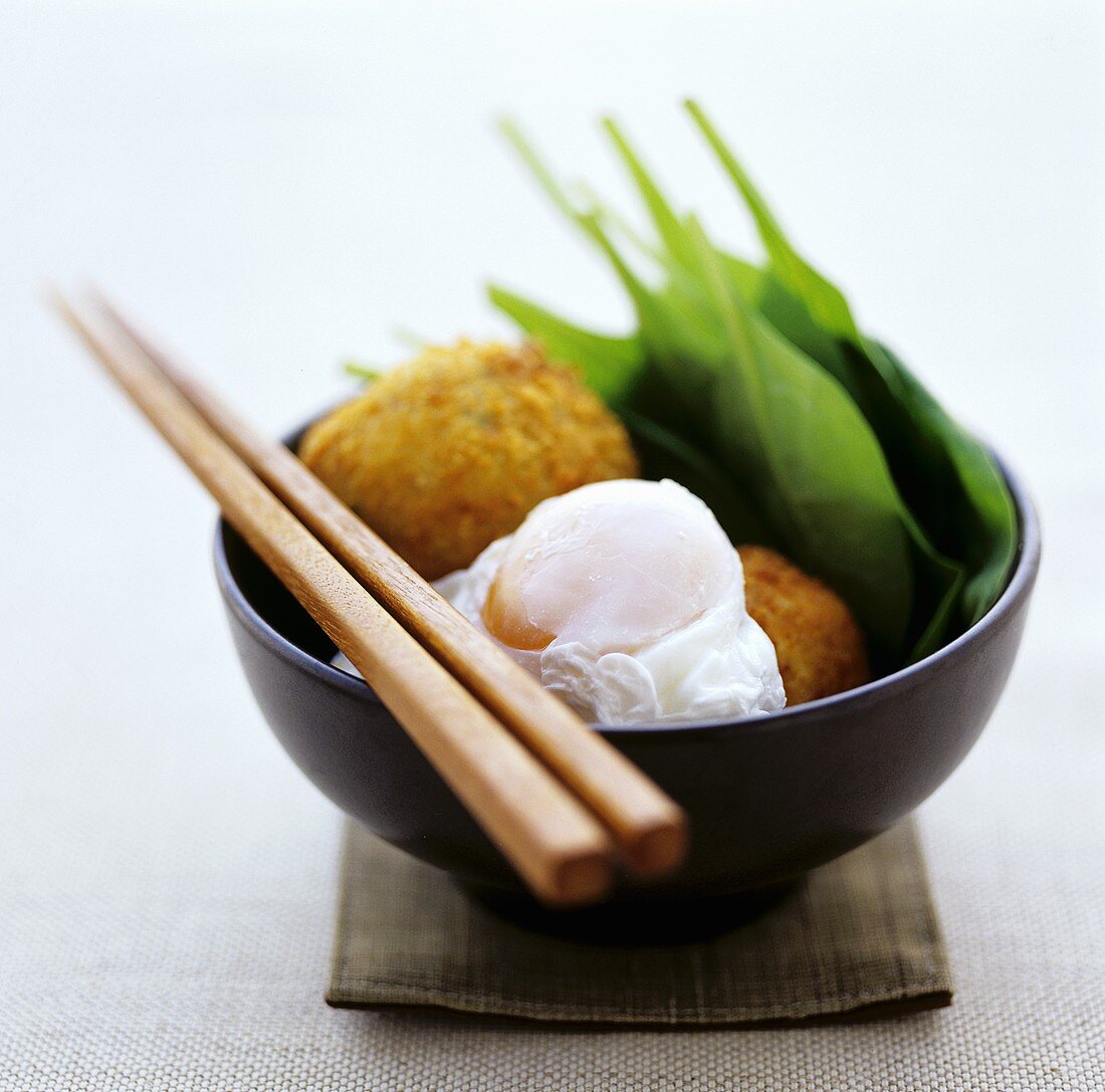 Deep-fried fish balls with poached egg