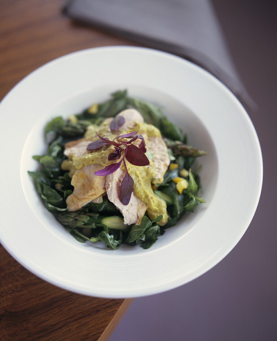 Green salad with asparagus and chicken breast