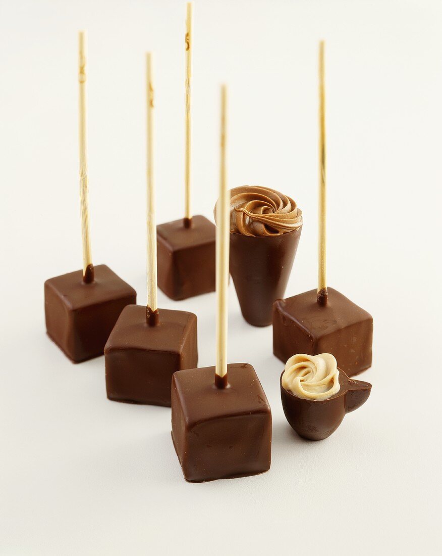 Cubes of drinking chocolate and chocolate cups