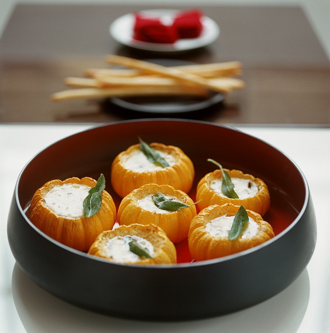 Baked mini pumpkins stuffed with cheese and sage