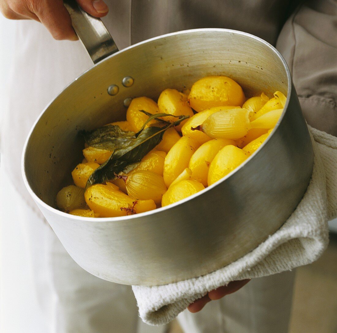 Cooked potatoes with shallots, saffron and bay leaves