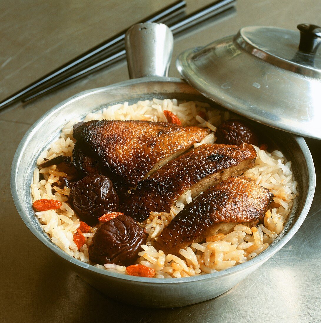 Grilled duck on a bed of rice