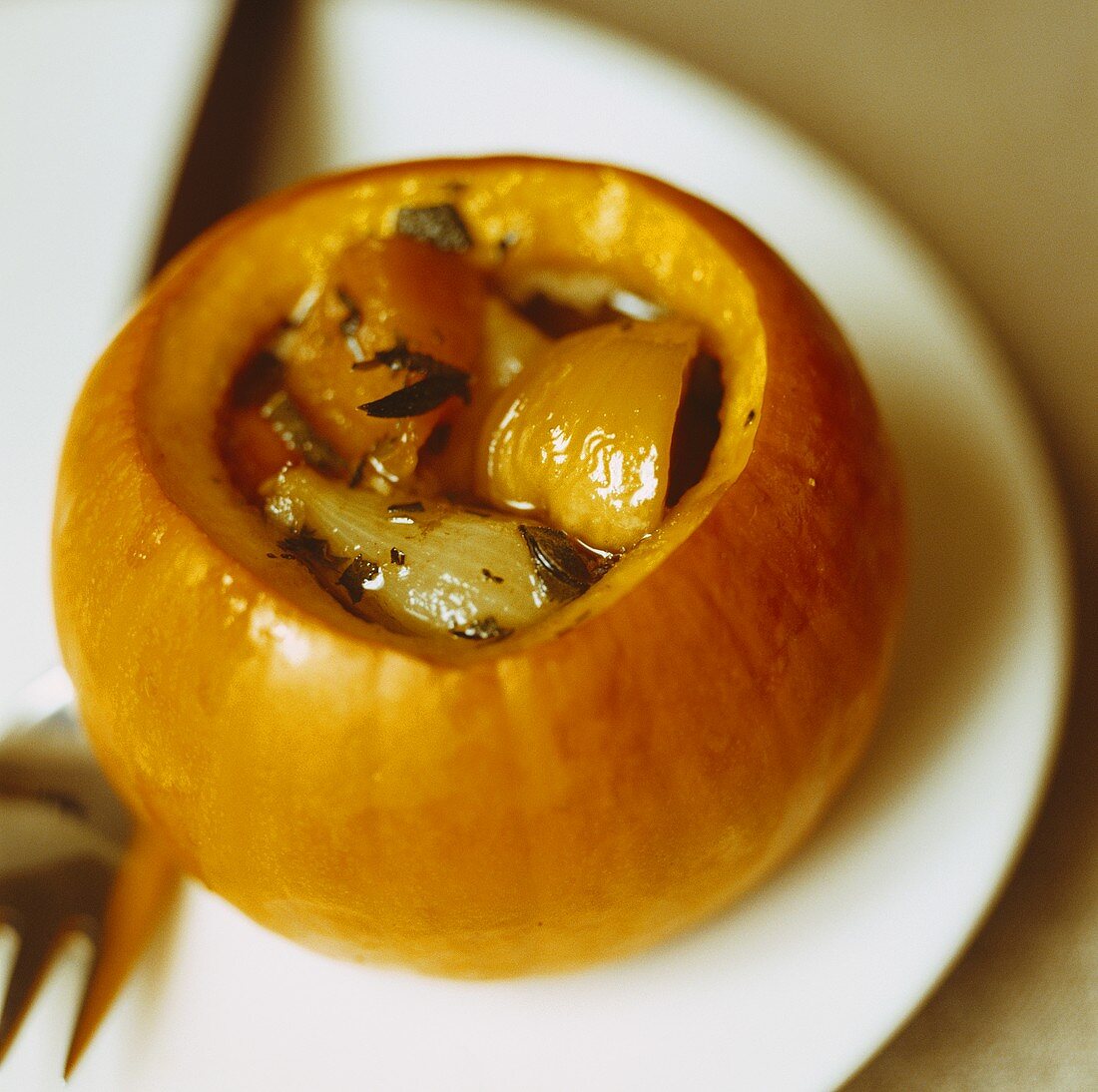 Pumpkin stuffed with shallots and chestnuts