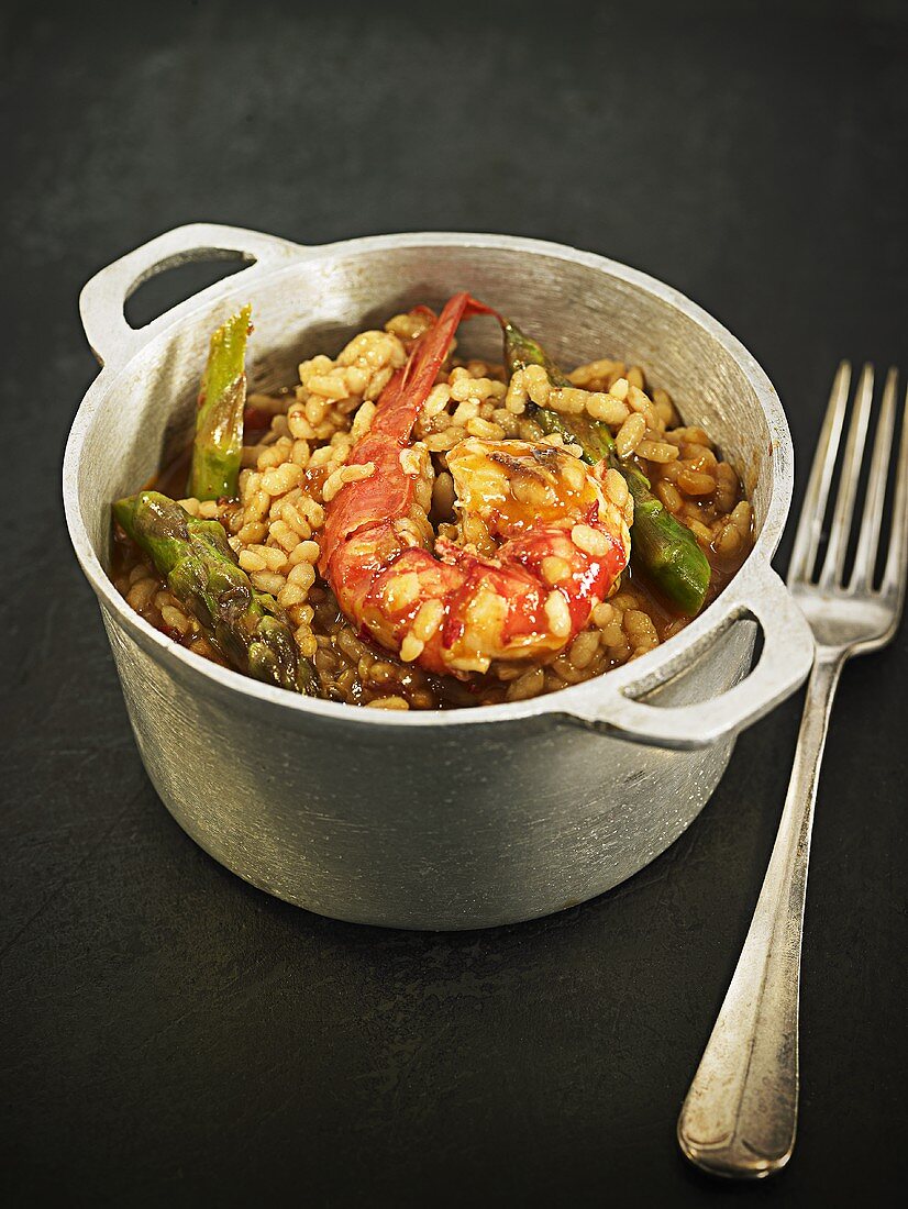 Arroz meloso (fried rice, Spain) with asparagus and king prawns