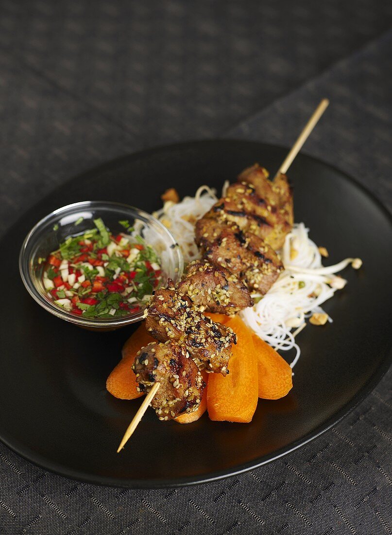 Pork kebab with rice noodles and carrots (Asia)