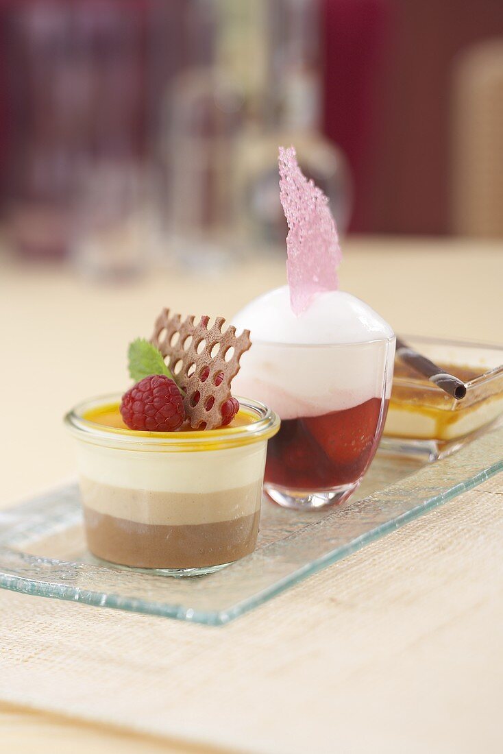 Various desserts: tri-layered mousse, berry soup and creme brulee