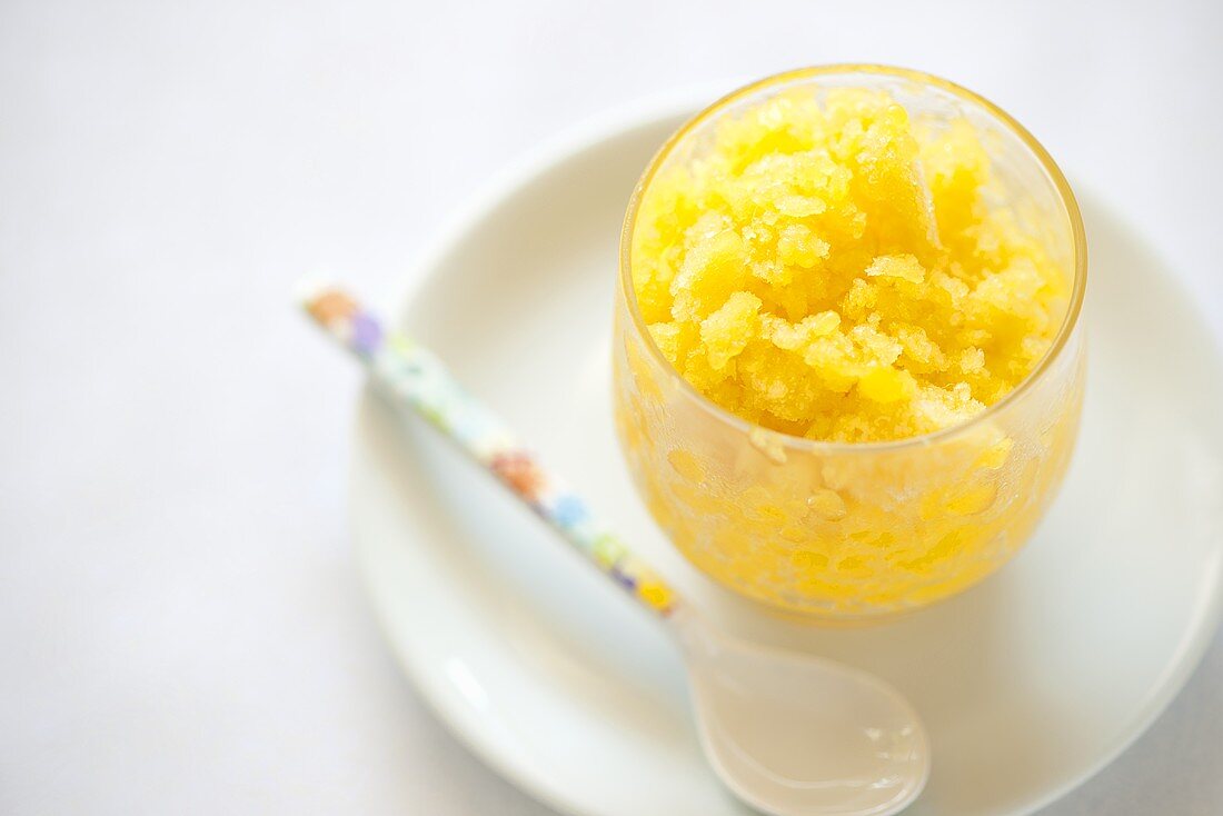 Mango granita in a glass bowl