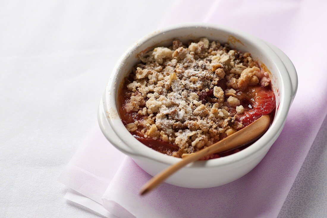 Plum Crumble in Individual Baking Dish; Spoon