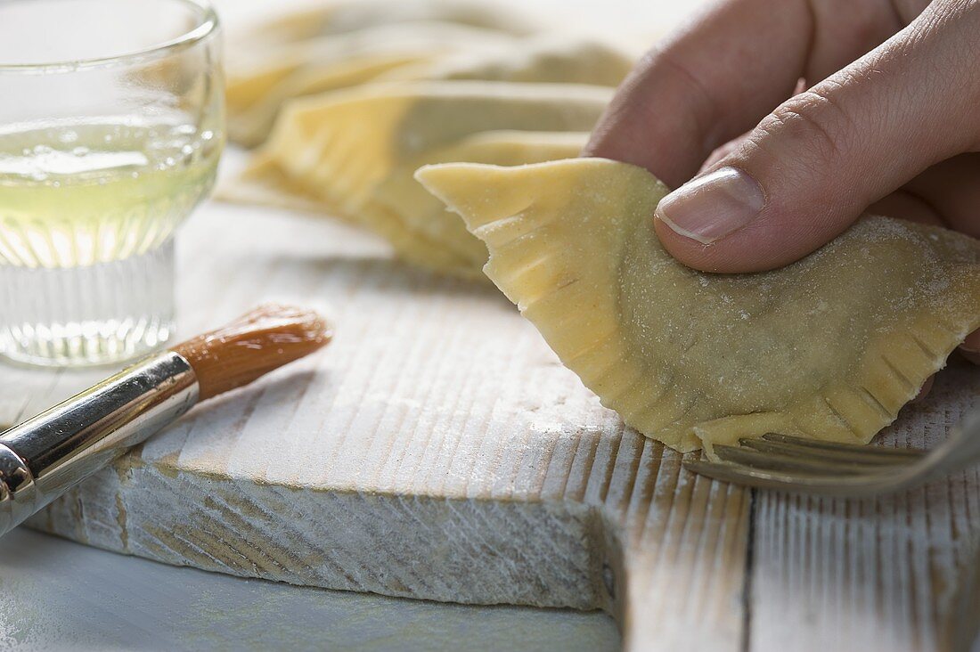 Ravioli with a braised meat filling being prepared