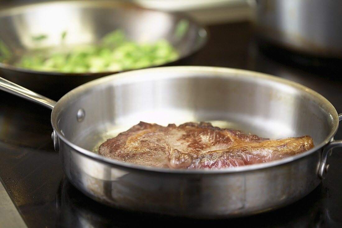 Fried beef steak in a pan