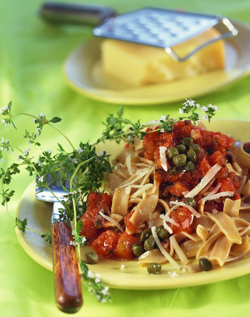 Wholemeal ribbon pasta with tomato & caper sauce and thyme