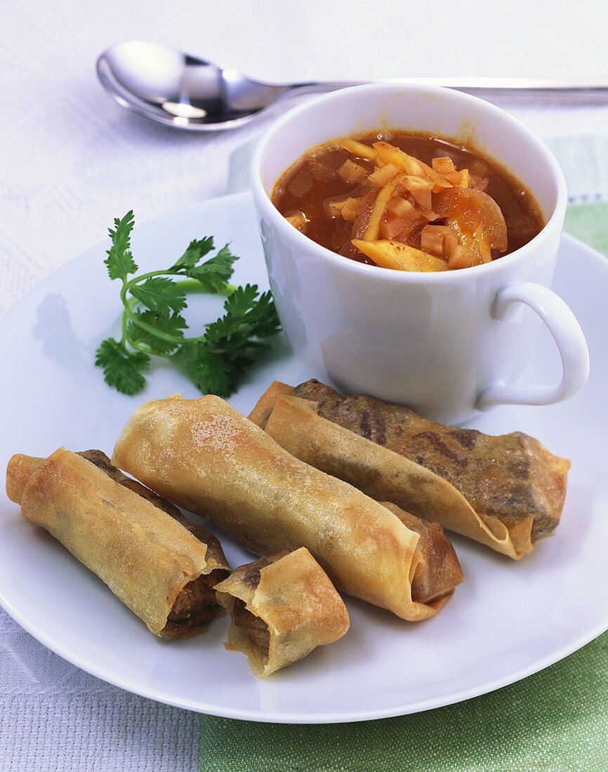 Goulash soup with mango and spring rolls with meat filling