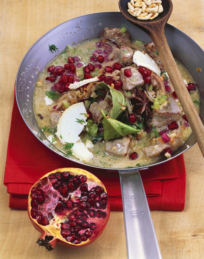 Veal blanquette with pomegranate seeds and goat's cheese