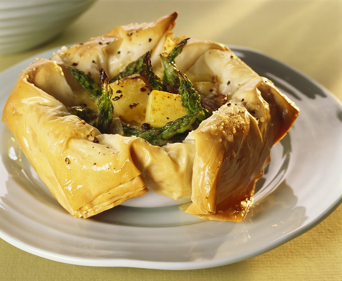 Green asparagus and diced potato in filo pastry shell