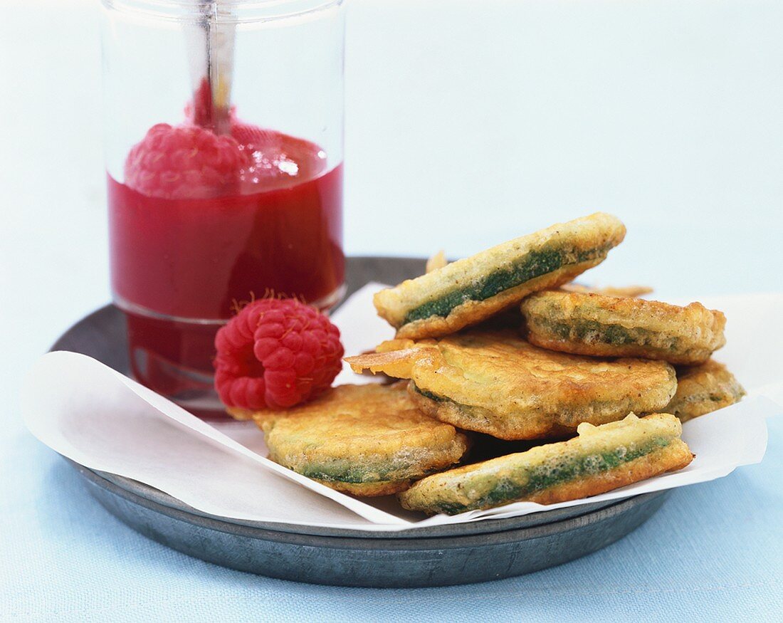 Courgette fritters with raspberry puree