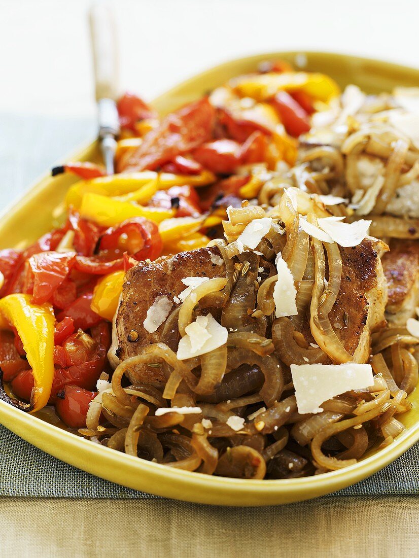 Pork chops with onions, peppers and Parmesan