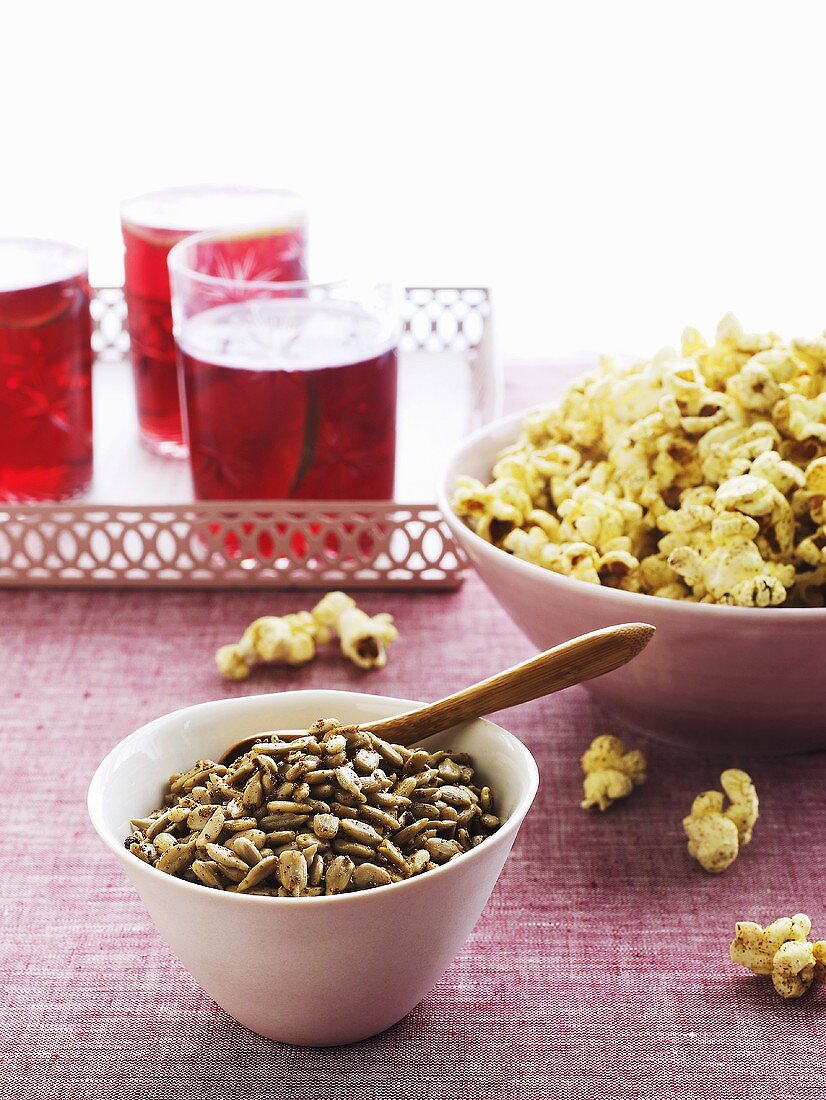 Spicy sunflower seeds, popcorn and fruit juice