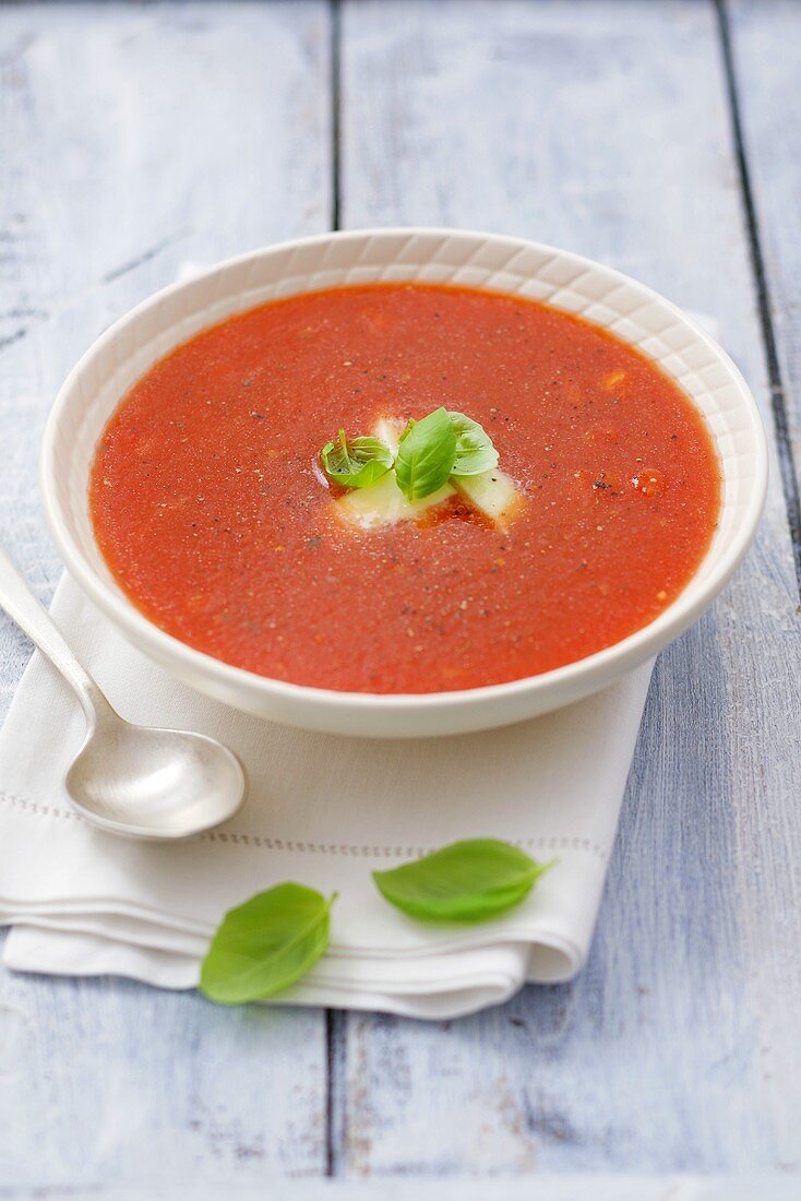 Tomato soup with mozzarella and basil