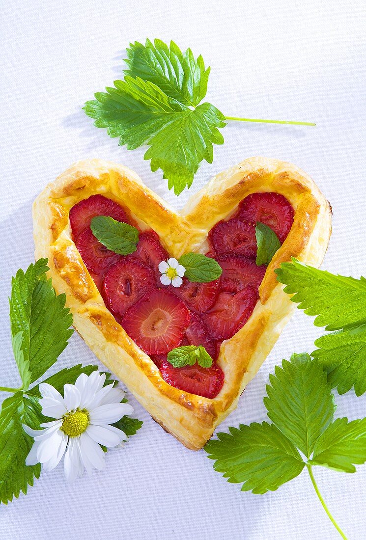 Heart-shaped strawberry puff pastry tart