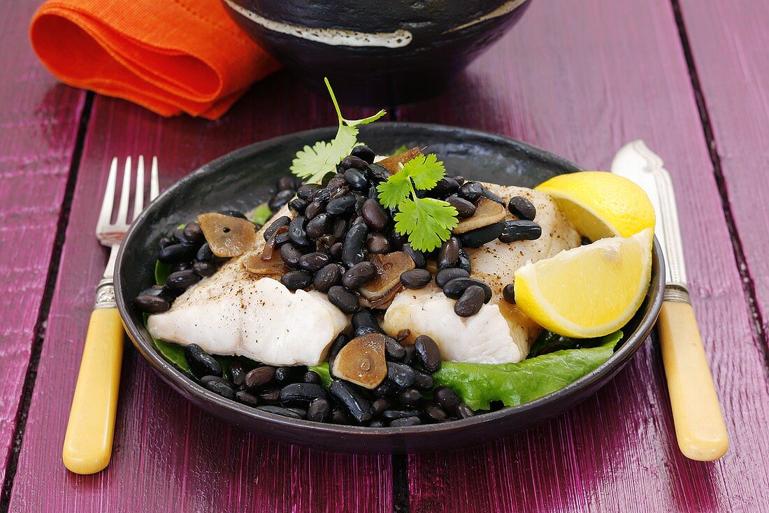 Cod with black beans, garlic and coriander