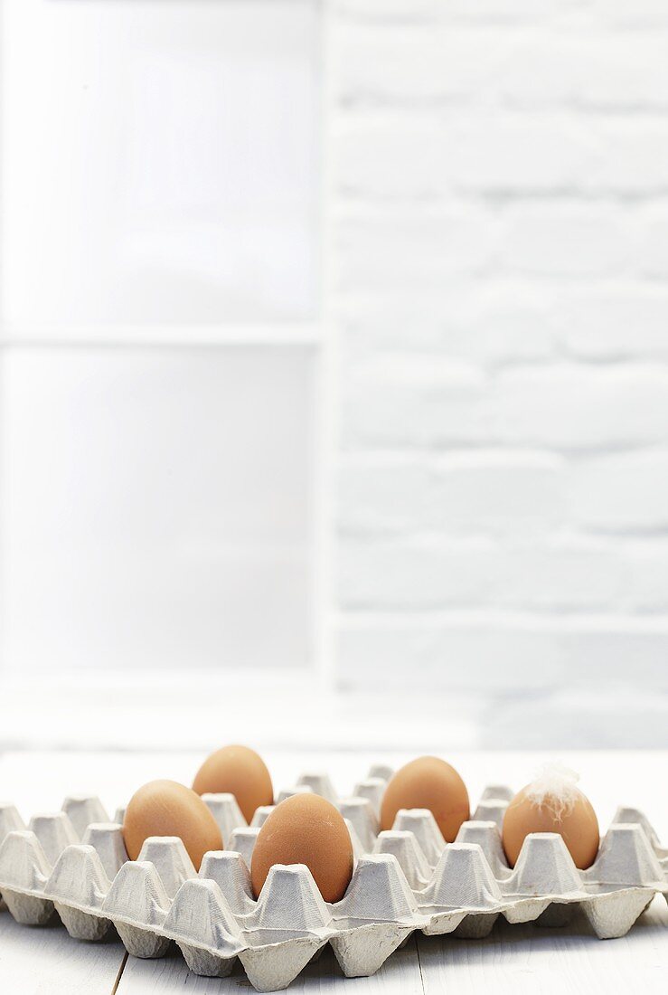 Brown eggs in egg tray